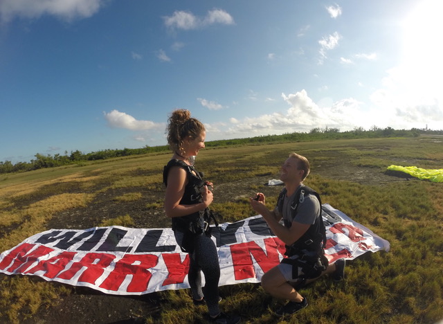 man proposing to a woman at a skydive drop zone