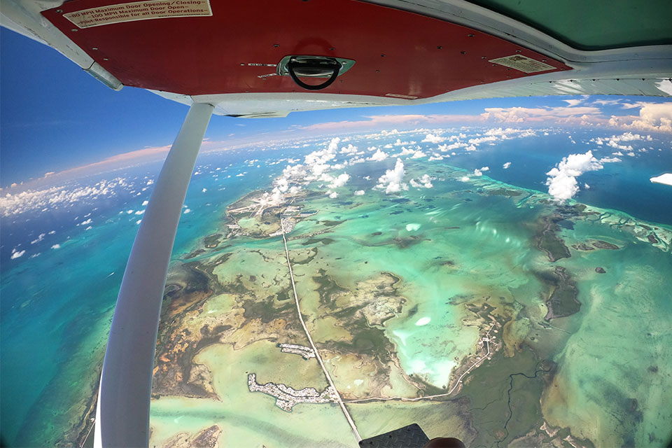 Stunning view of turquoise waters from the skydiving airplane at Skydive Key West over the Florida Keys. 