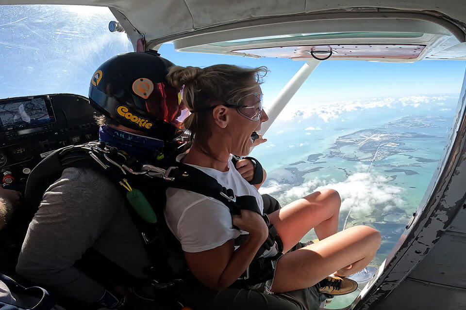 Tandem instructor and student prepared to exit the aircraft at Skydive Key West.