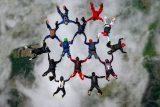 Skydivers working together to form a beautiful design in the sky over Skydive Key West