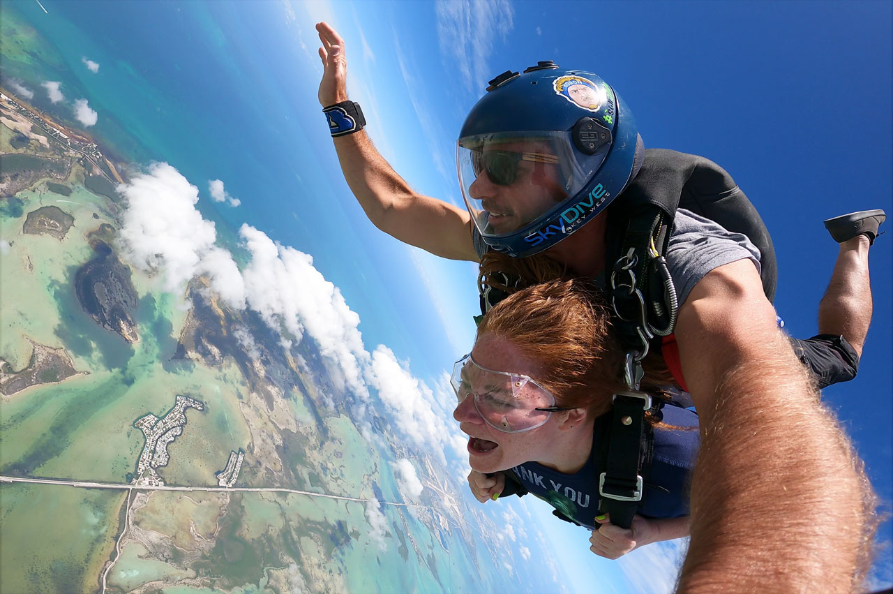 Tandem skydiving student and instructor in freefall over the Florida Keys