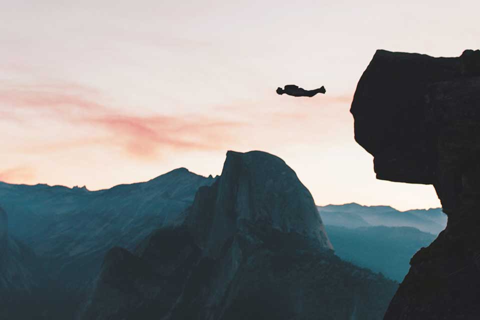 BASE jumper exits a cliff near Yosemite, CA.