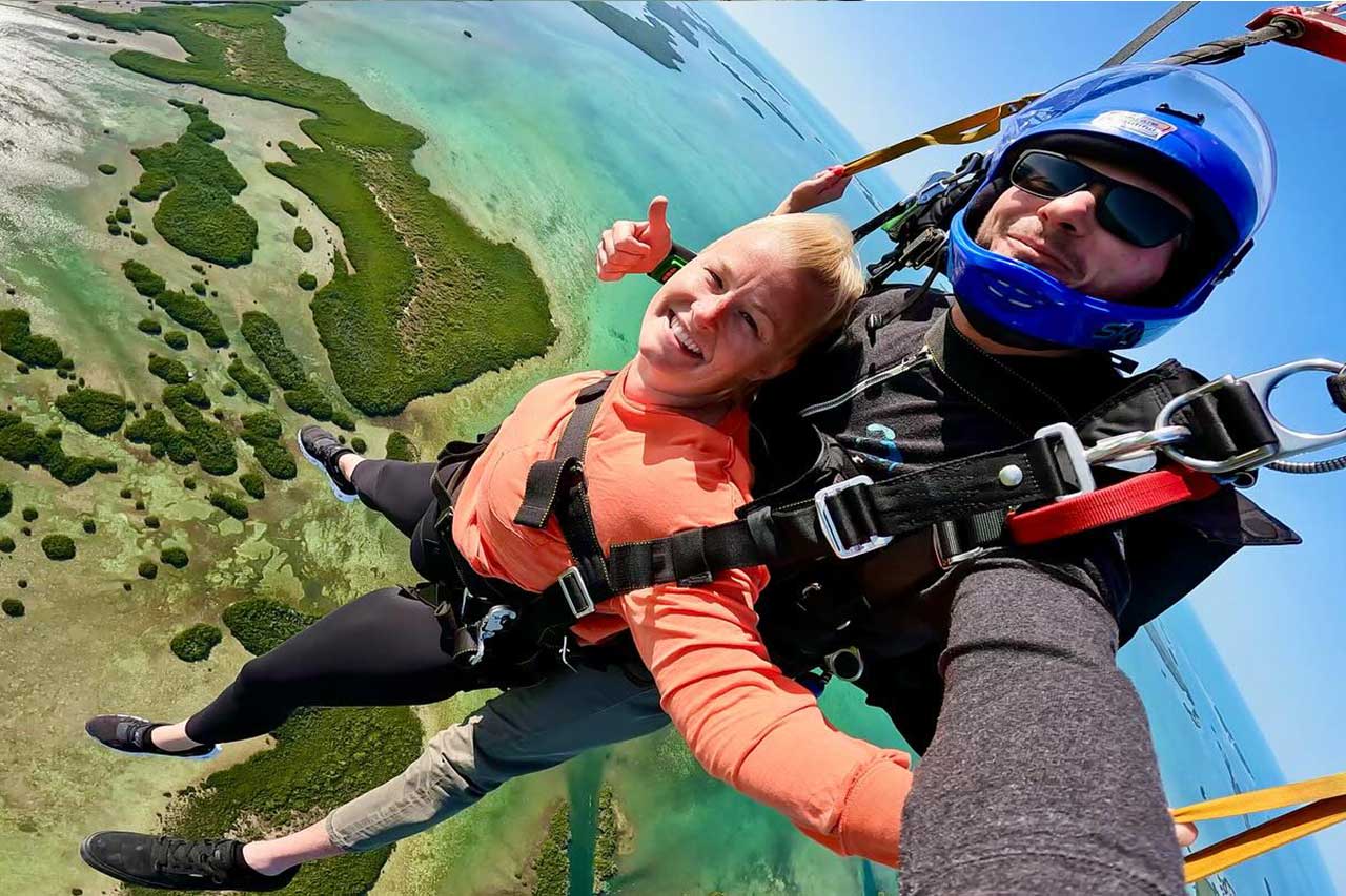 Male and female tandem skydiving pair at Key West