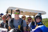 Young tandem jumpers driving a golf cart after enjoying Florida Keys Skydiving