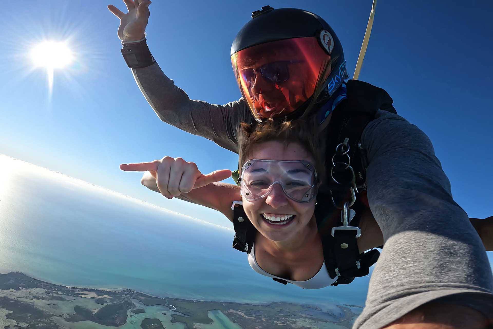 Woman smiles during her jump at Skydive Key West