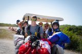 Young tandem jumpers driving a golf cart after enjoying Florida Keys Skydiving
