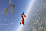 solo wingsuit skydiver soaring high above skydive key west
